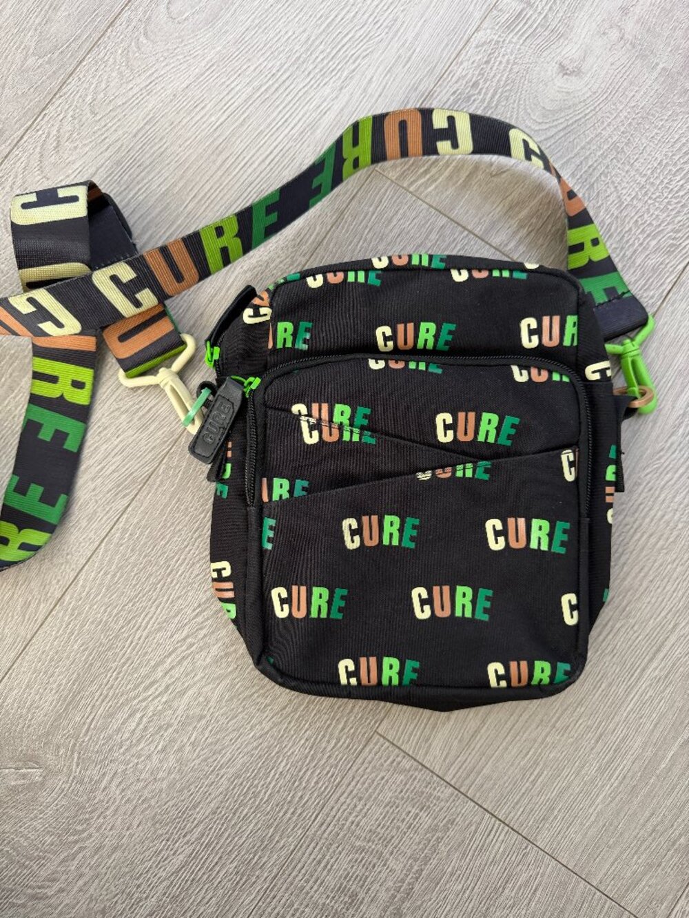 CURE by WCC Limited Edition Black Neon Logo Mini Messenger Bag